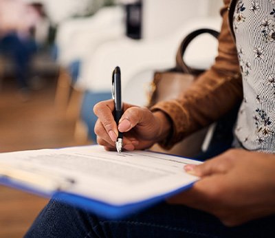 Patient filling out form in lobby