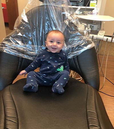 Infant in dental treatment chair