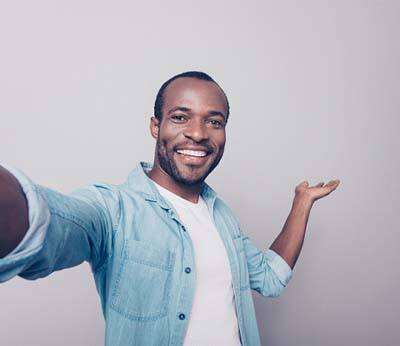 man smiling after making the investment in cosmetic dentistry in Bellbrook