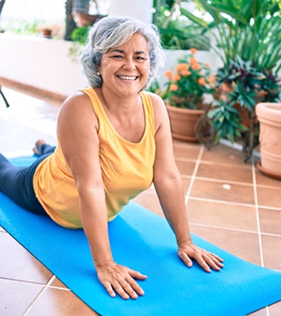 a person doing yoga in their sunroom