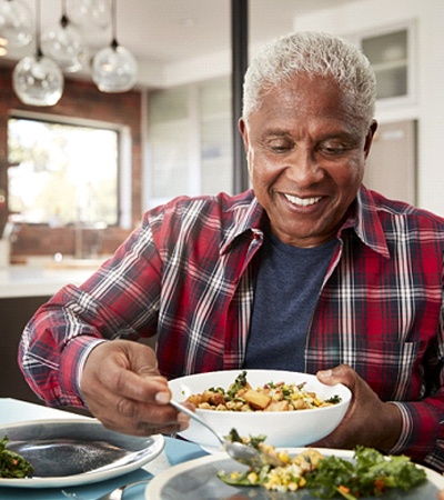 a person eating dinner with their family