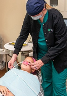 Man in need of emergency dentistry holding jaw in pain