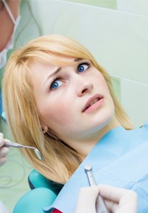 Woman nervous in the dental chair