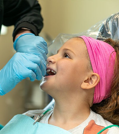 Child receiving fluoride treatment