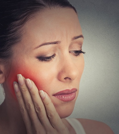 A woman suffering from a severe toothache