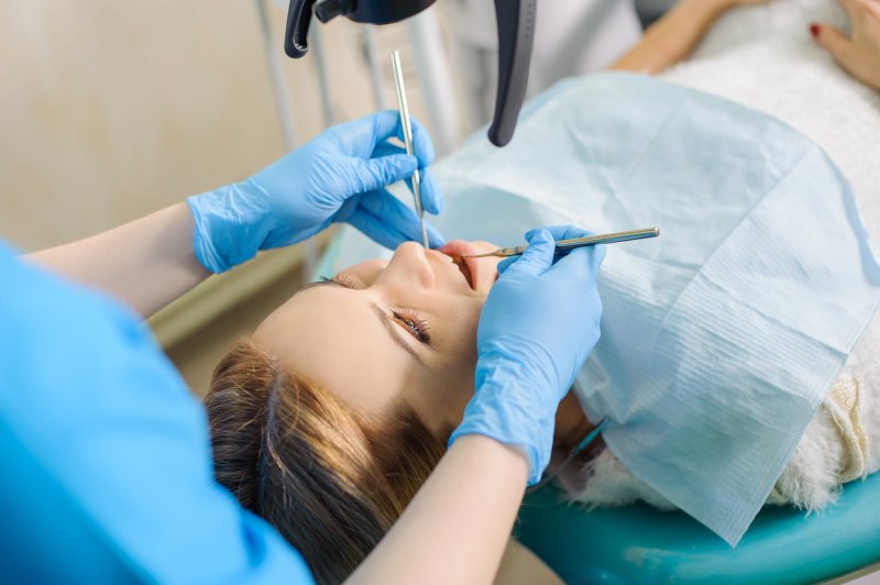 A closeup of a woman getting root canal therapy