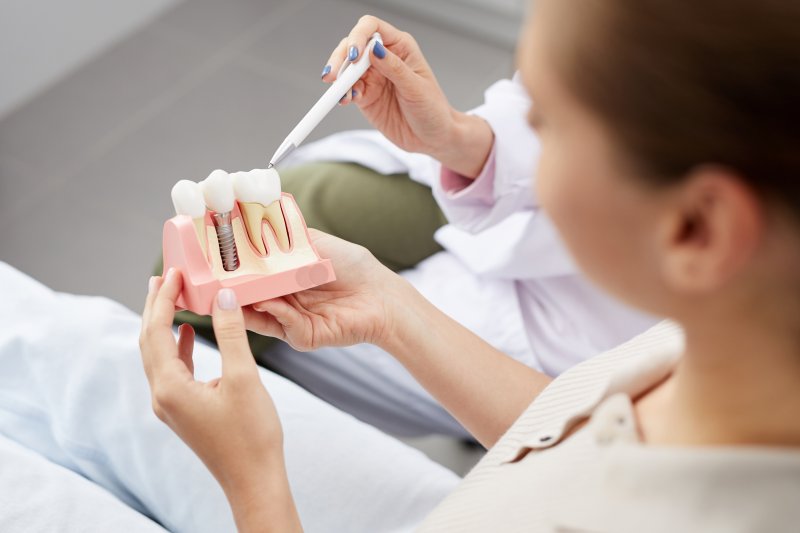 patient listening to dentist discuss dental implants